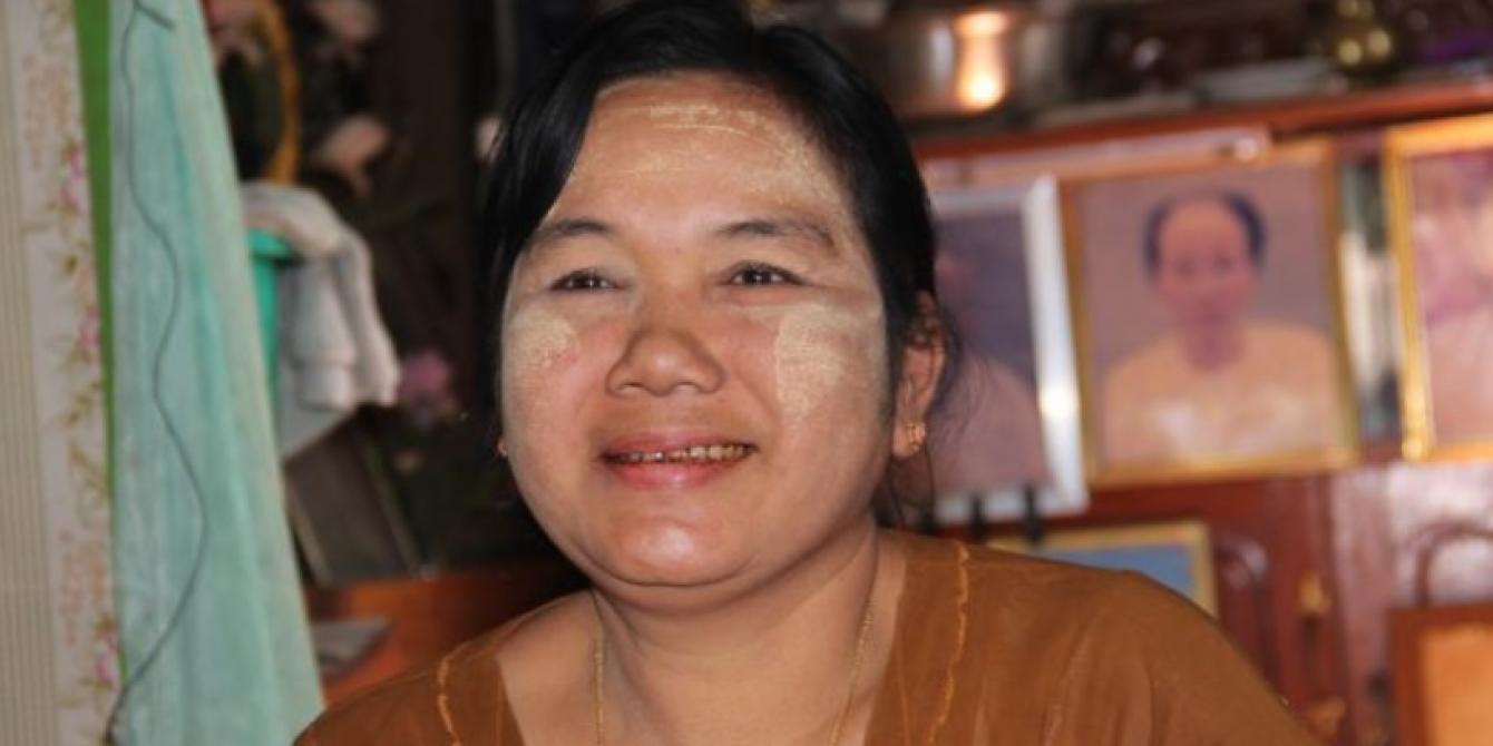 Daw Myint Myint Kyi (aka) Ma Ma, Photo by: Yee Mon Oo/Oxfam Daw Myint Myint Kyi (aka) Ma Ma is smiling inside her house. Photo by: Yee Mon Oo/Oxfam